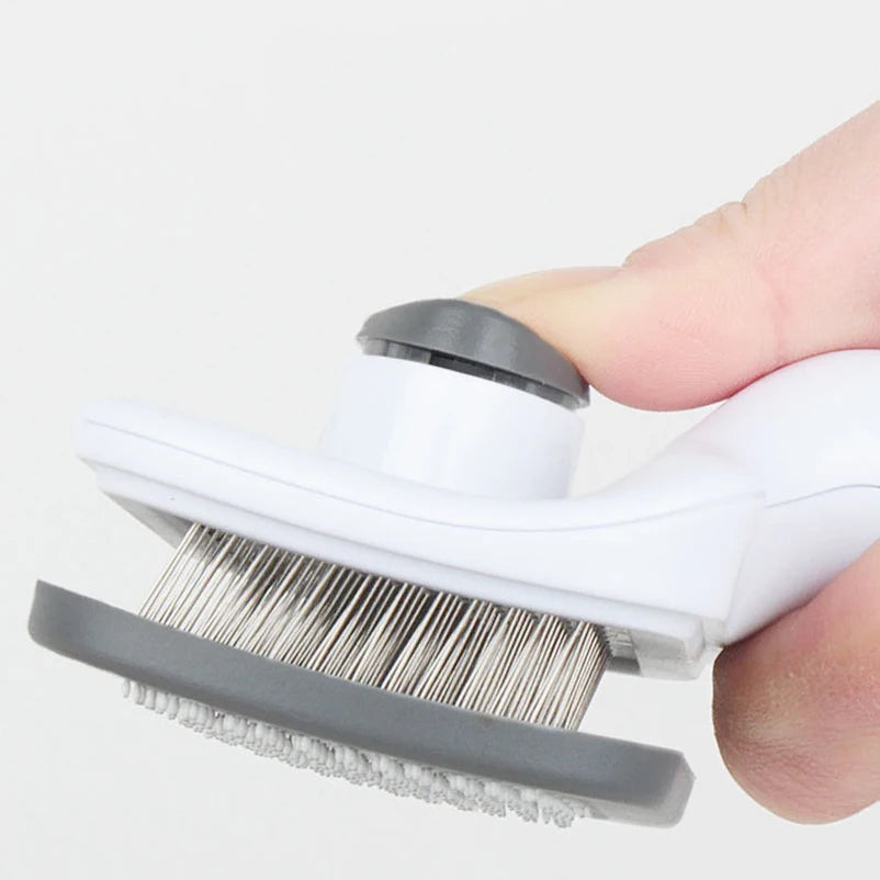 Self-cleaning slicker brush